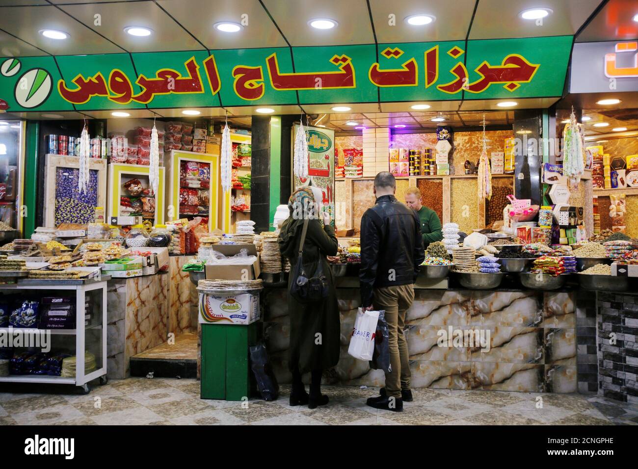 Iraqi people buy nuts from a nuts shop in Mosul, Iraq February 24, 2018.  REUTERS/Khalid Al-Mousily Stock Photo - Alamy