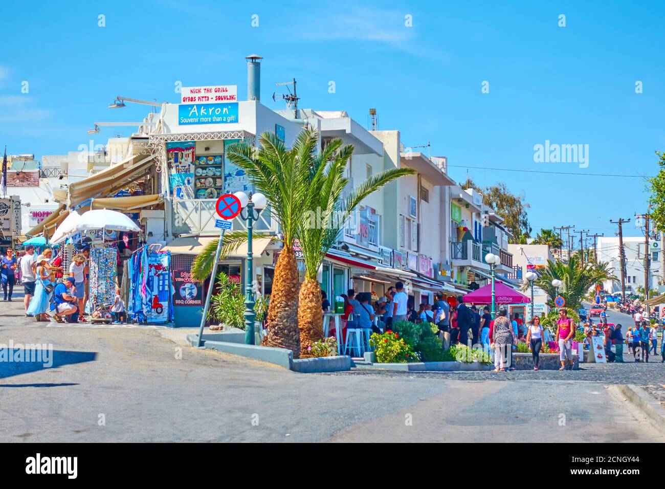 Fira, Santorini island, Greece - April 25, 2018: Shopping district with walking people in Fira (Thera) Stock Photo