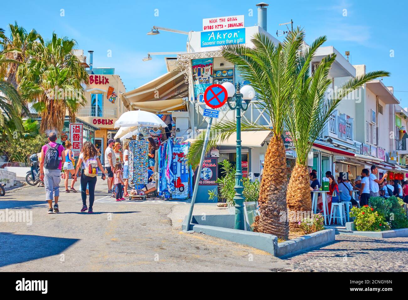 Fira, Santorini island, Greece - April 25, 2018: Shopping street with walking people in Fira (Thera) Stock Photo