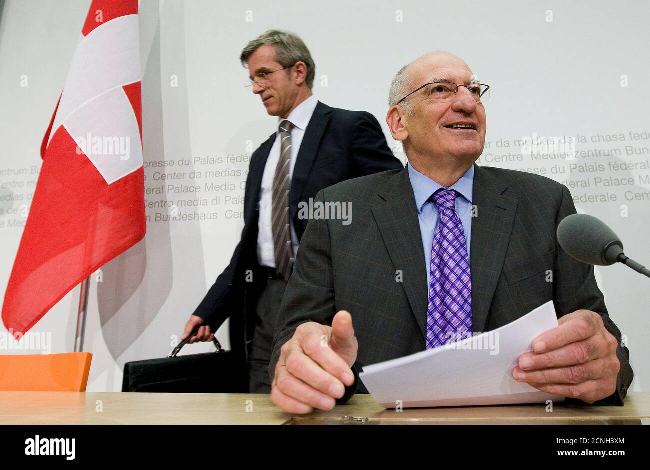 Swiss Interior Minister Pascal Couchepin (R) and Thomas Zeltner, Director of the Federal Office of Public Health (BAG) arrive before a news conference on the popular vote ' Yes to the complementary medicine' ('Ja zur Komplementaermedizin') in Bern April 9, 2009. REUTERS/Pascal Lauener (SWITZERLAND) Stock Photo