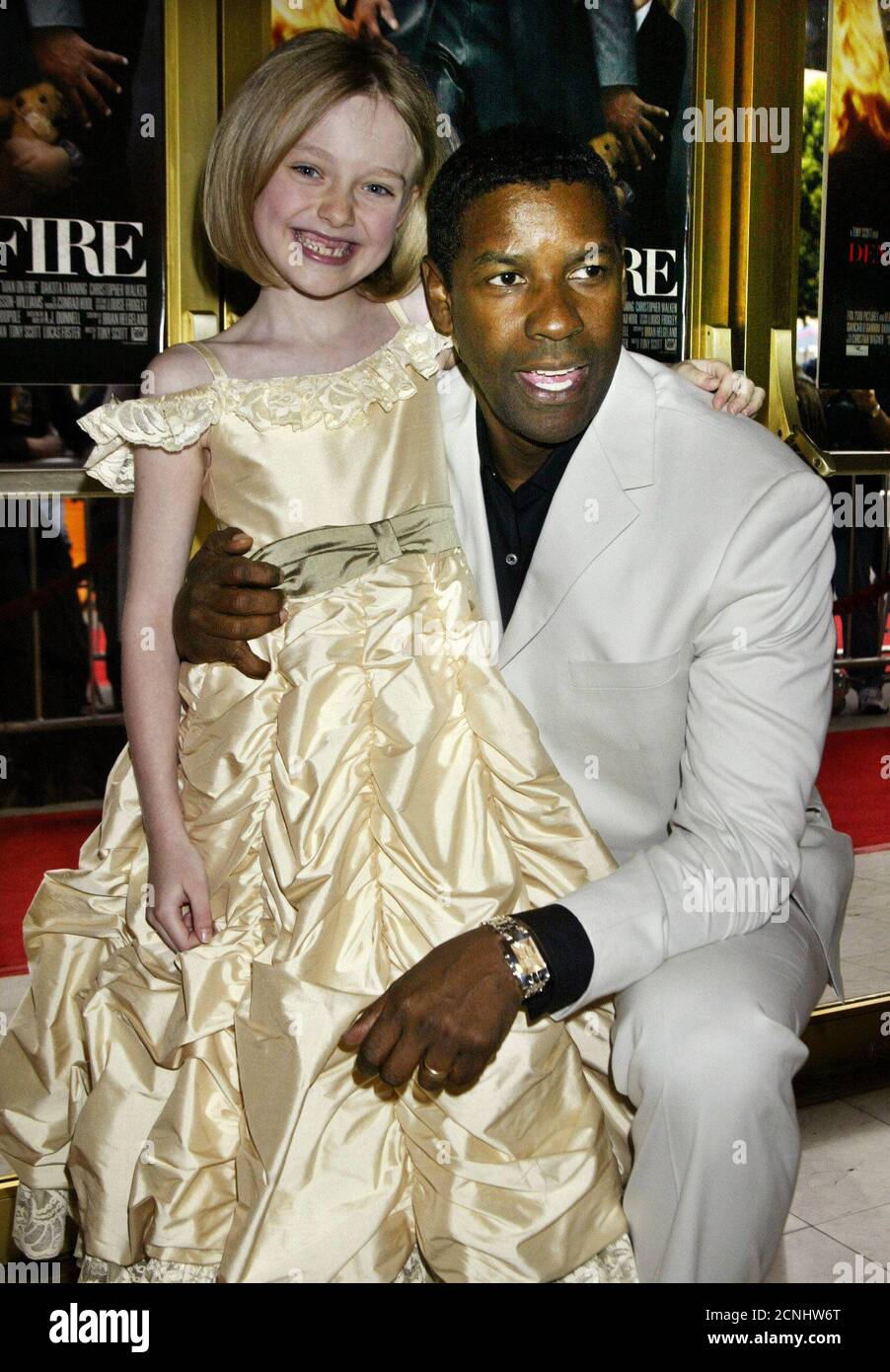Actor Denzel Washington And Young Co Star Dakota Fanning Pose At The Premiere Of Their New Drama Film Man On Fire In Los Angeles