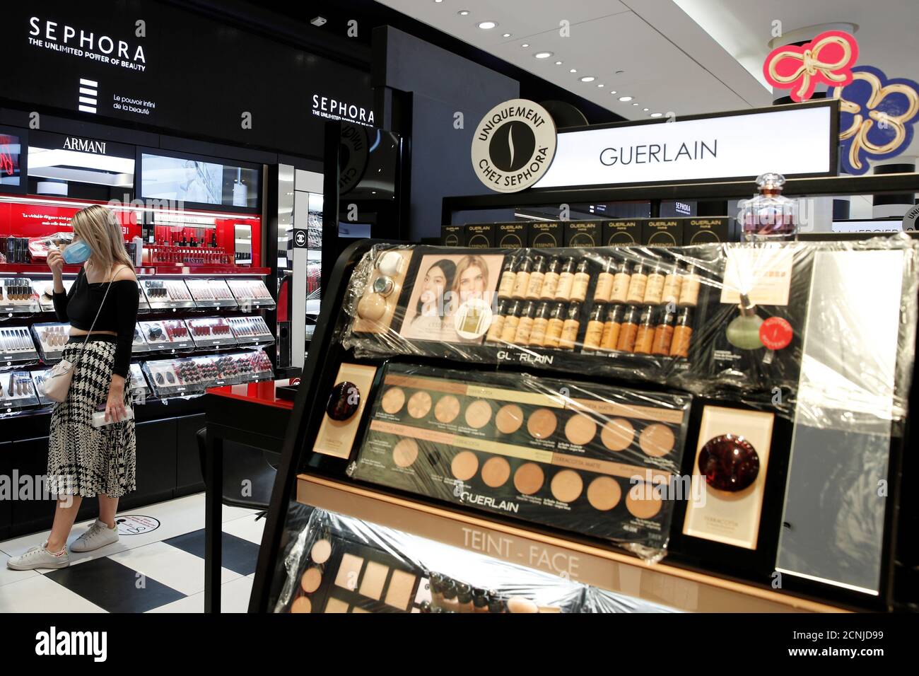 Guerlain make-up products are seen behind a plastic cover at a Sephora  store on the Champs Elysees Avenue in Paris as France softens its strict  lockdown rules during the outbreak of the