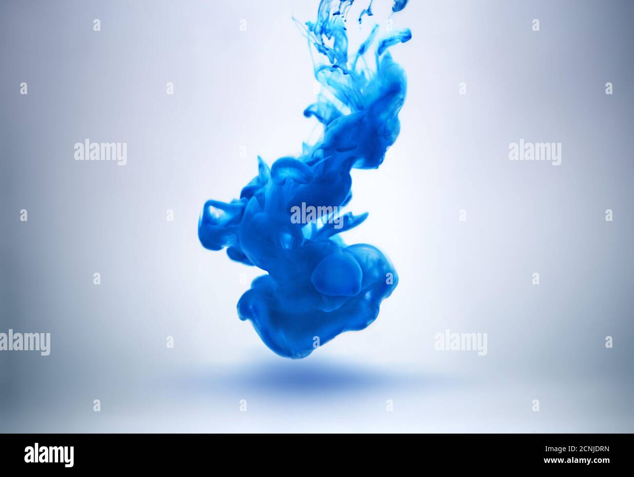 blue ink underwater Stock Photo - Alamy