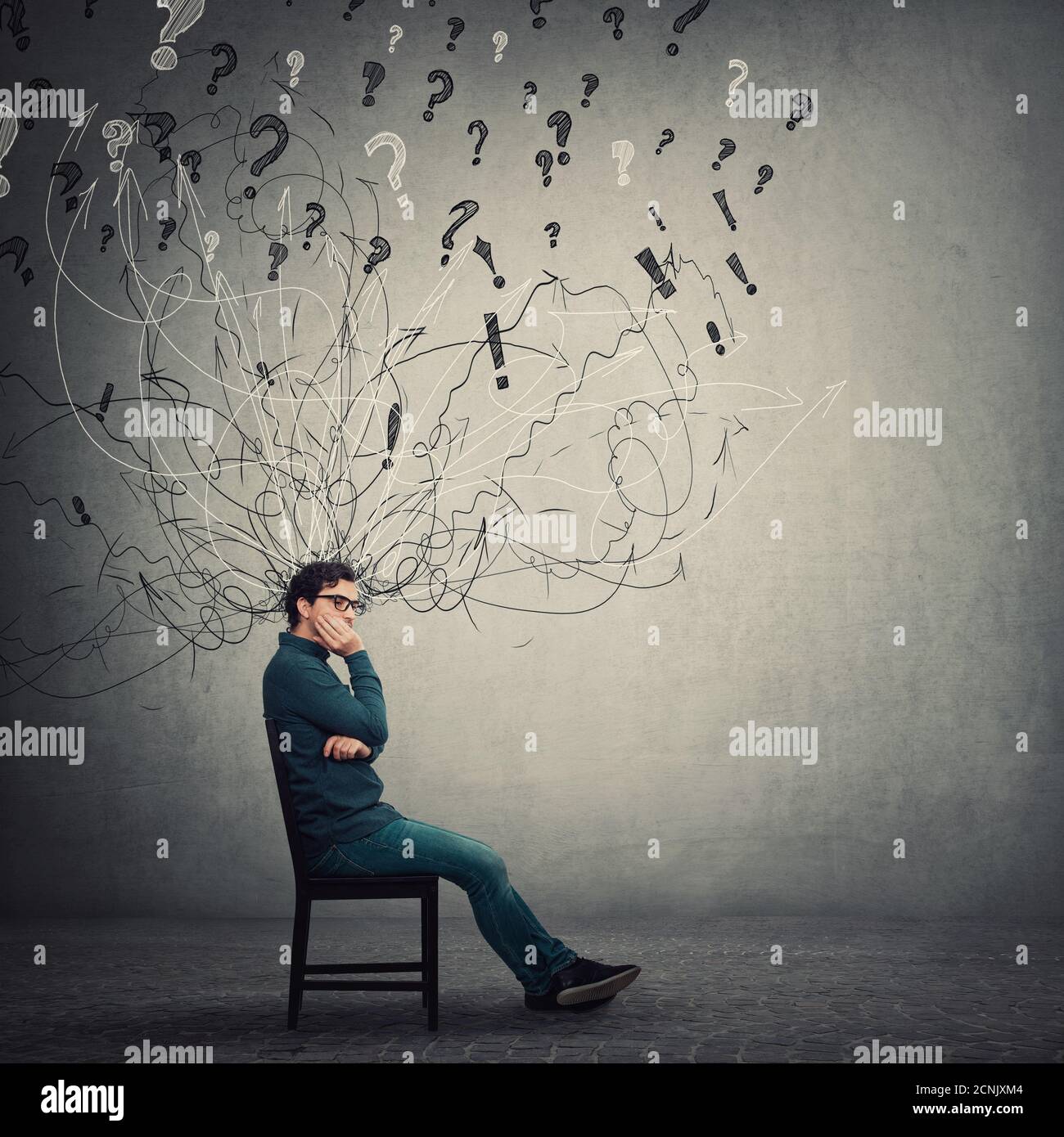 Pessimistic, disappointed businessman sit on chair, keeps hand under cheek, looking thoughtful and annoyed. Dissatisfied business person negative thin Stock Photo