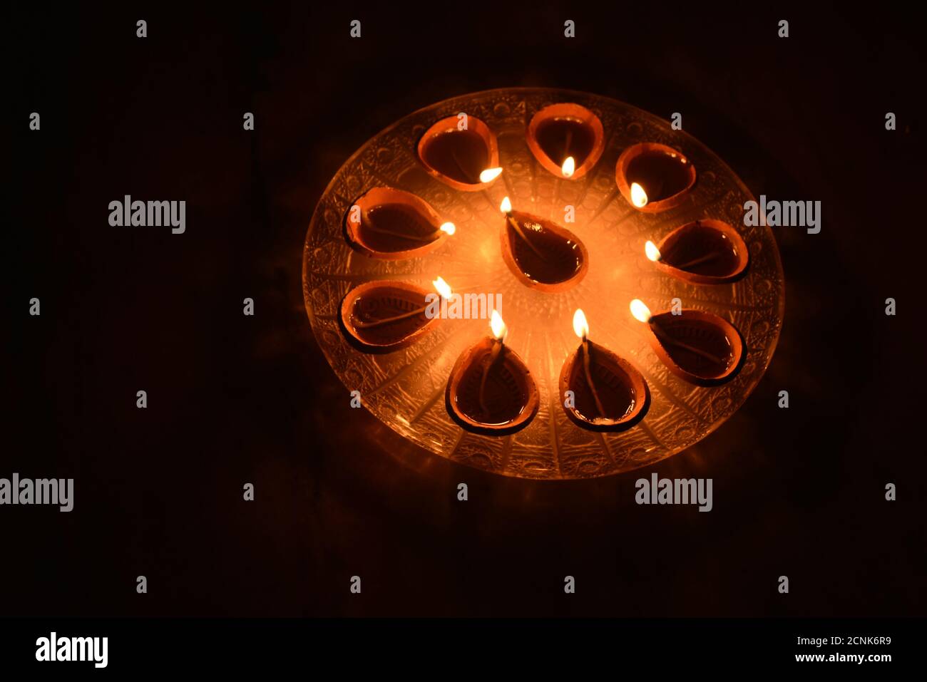 Burning oil lamps in dark background Stock Photo