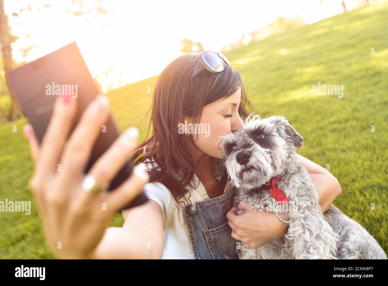 Portrait of a happy caucasian woman who hugs her beloved dog and Makes selfie with him .The concept of love for animals. best fr Stock Photo