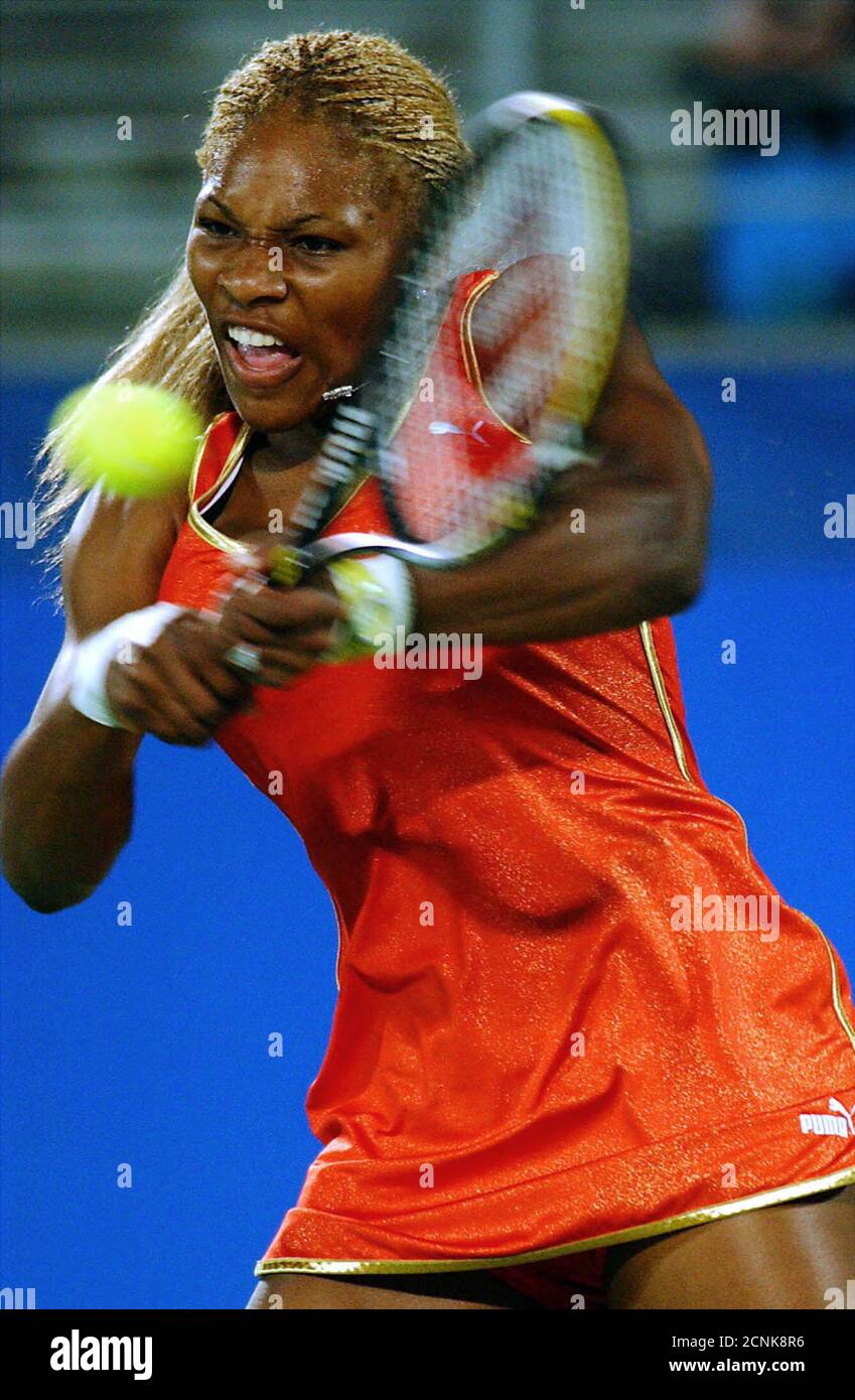 Serena Williams of the U.S. on her way to beating Amelie Mauresmo of France  at the Adidas International in Sydney on January 9, 2002. Number  four-seeded Williams beat sixth-seeded Mauresmo 6-4 7-6 (