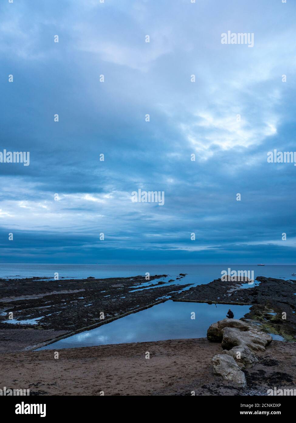 Person Sitting on Rock, Salt Water Swimming Pool, Castle Sands Beach