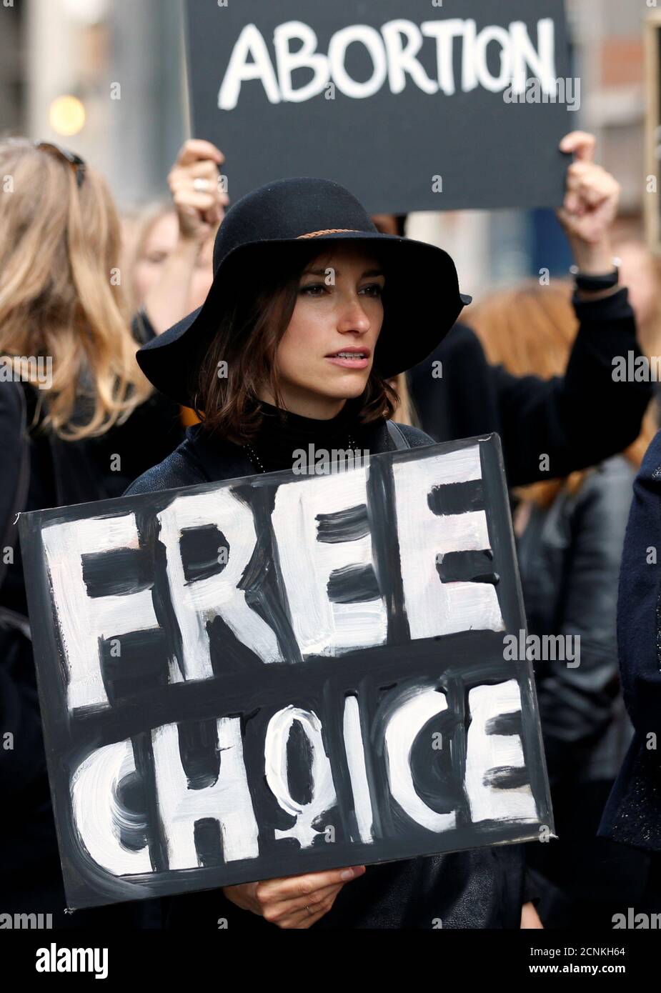 A demonstrator holds a sign to protest against a proposed parliament bill to completely ban abortion in Poland, in front of EU institutions in Brussels, Belgium, October 3, 2016. REUTERS/Francois Lenoir Stock Photo