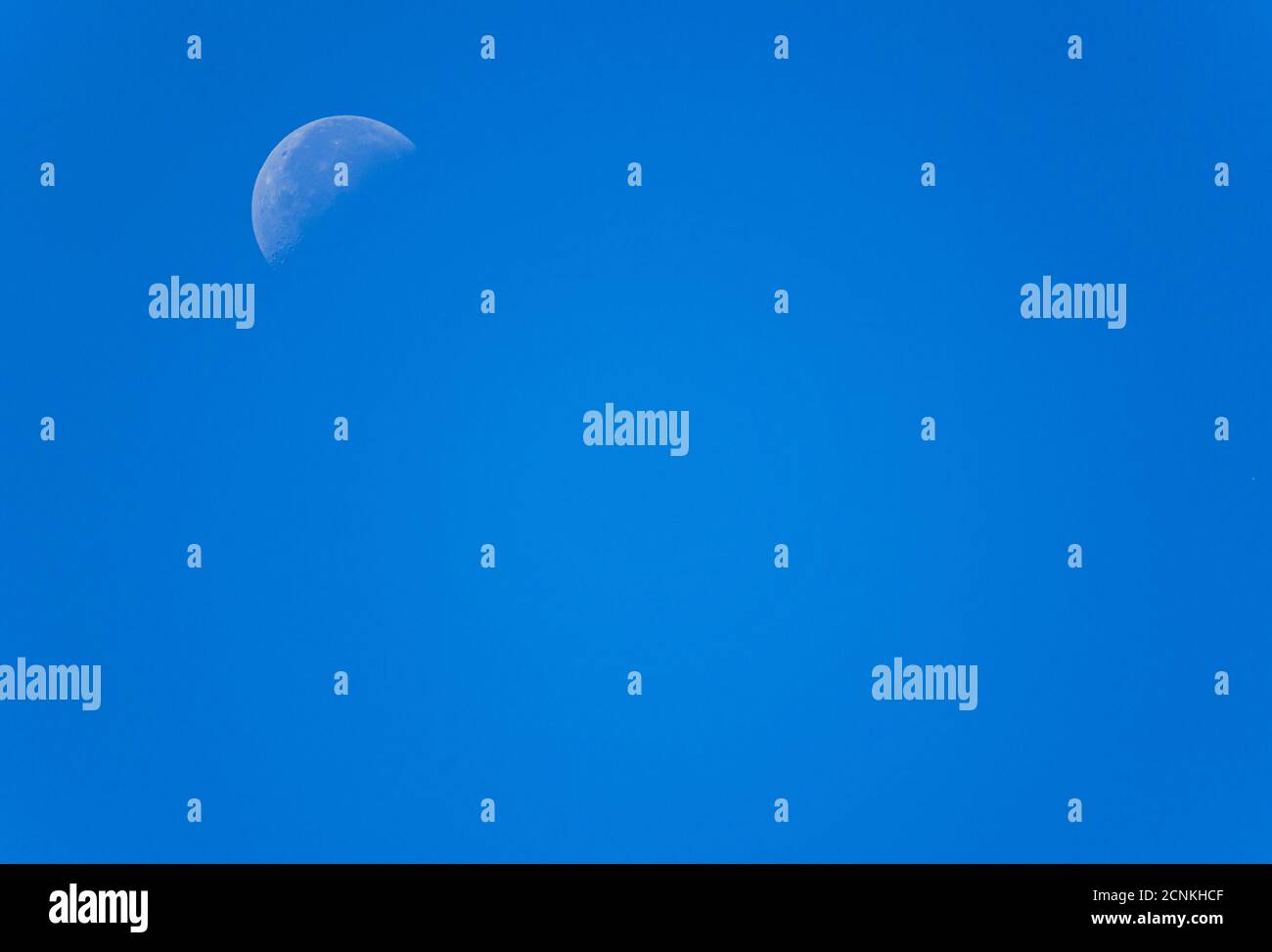 Waning crescent moon in blue sky, Bavaria, Germany, Europe Stock Photo
