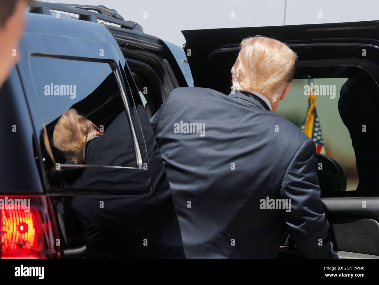 U.S. President Donald Trump gets into his armored U.S. Secret Service sports utility vehicle as he arrives to visit a nearby U.S. Border Patrol station and a U.S.-Mexico border wall site after landing at Marine Corps Air Station Yuma in Yuma, Arizona, U.S., June 23, 2020. REUTERS/Carlos Barria Stock Photo