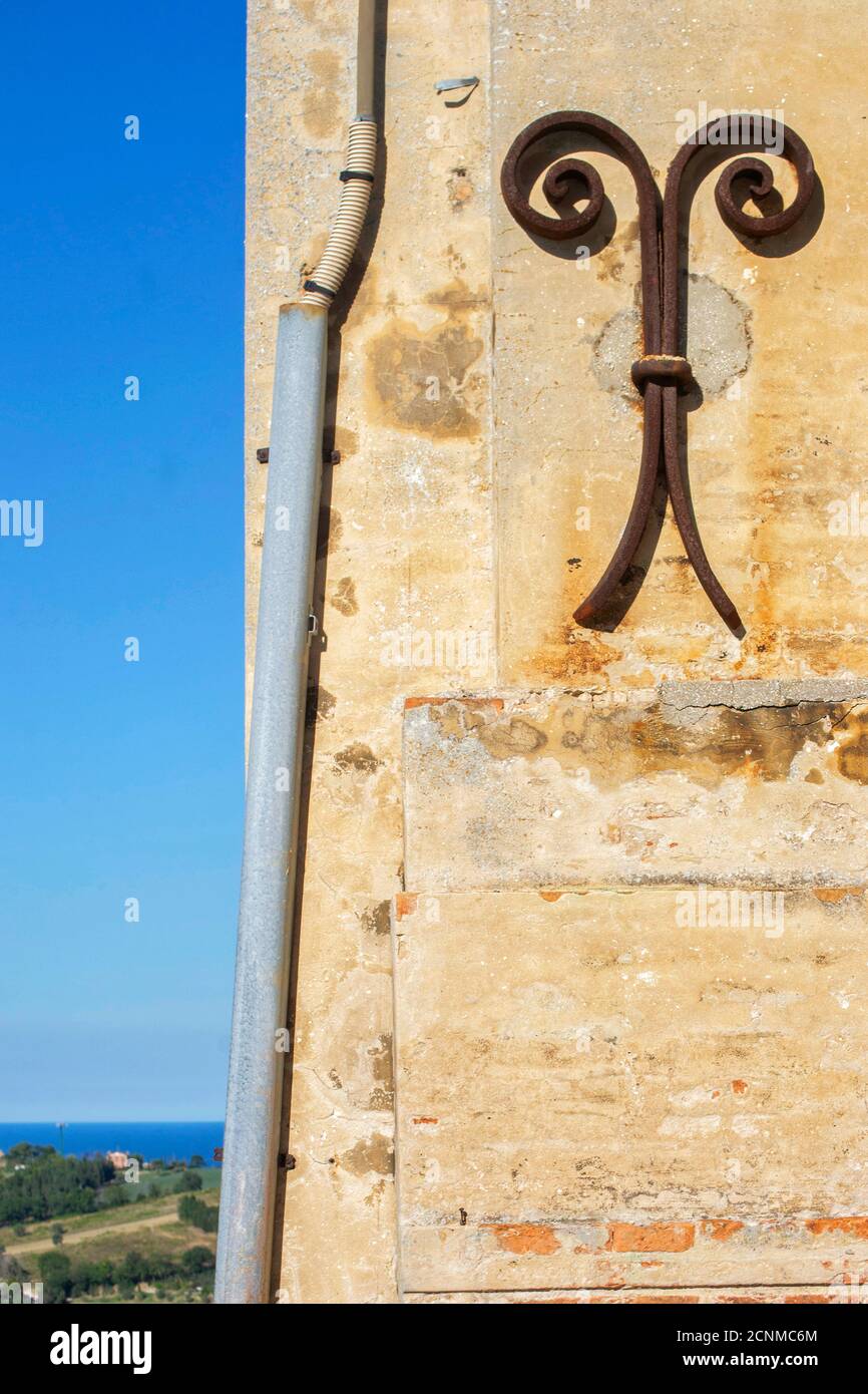 Gutter Tie Rode part of a facade of an old building with wrought iron tie rods and a ...