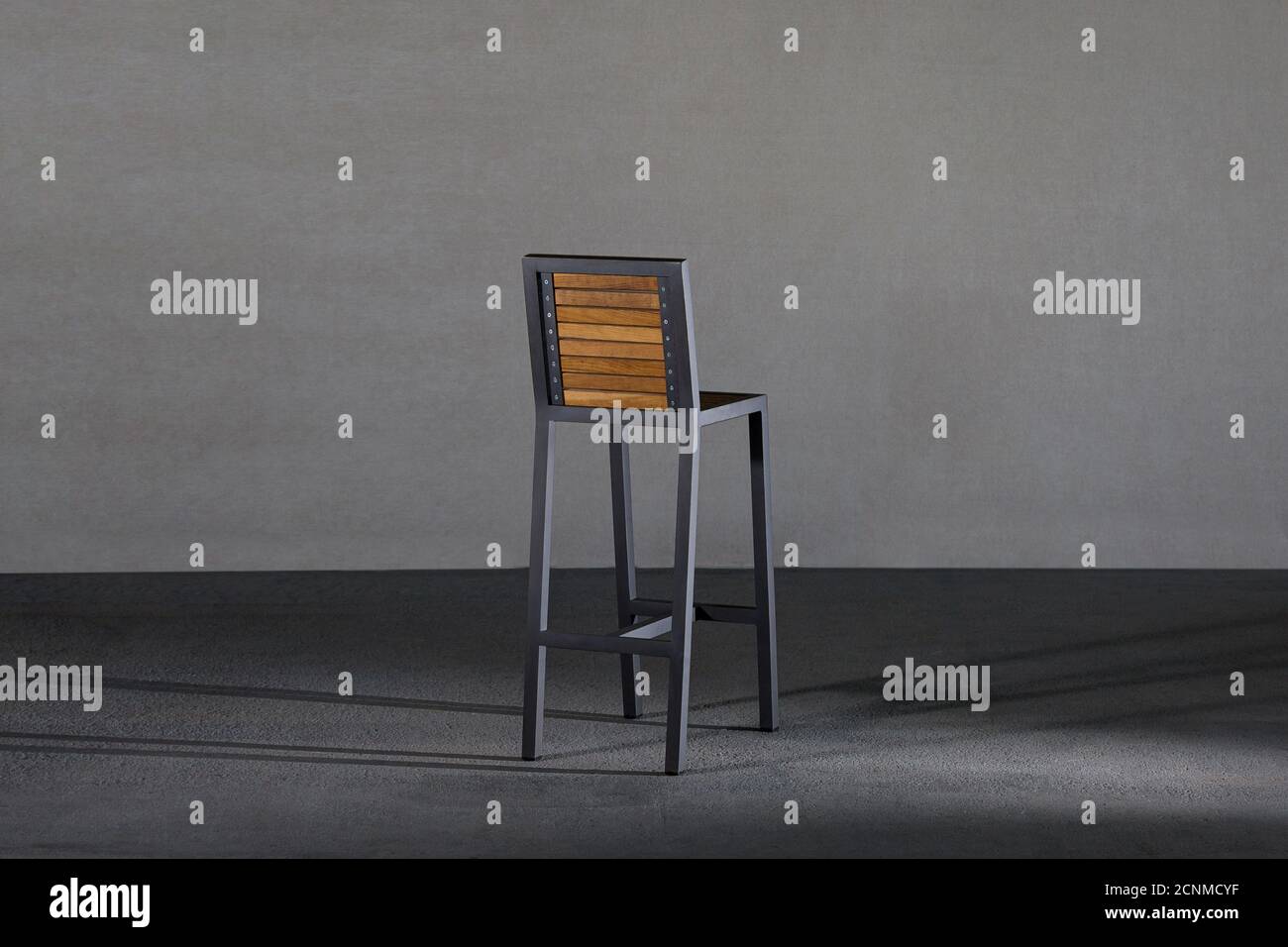 Wooden stool with metal legs in a studio Stock Photo Alamy