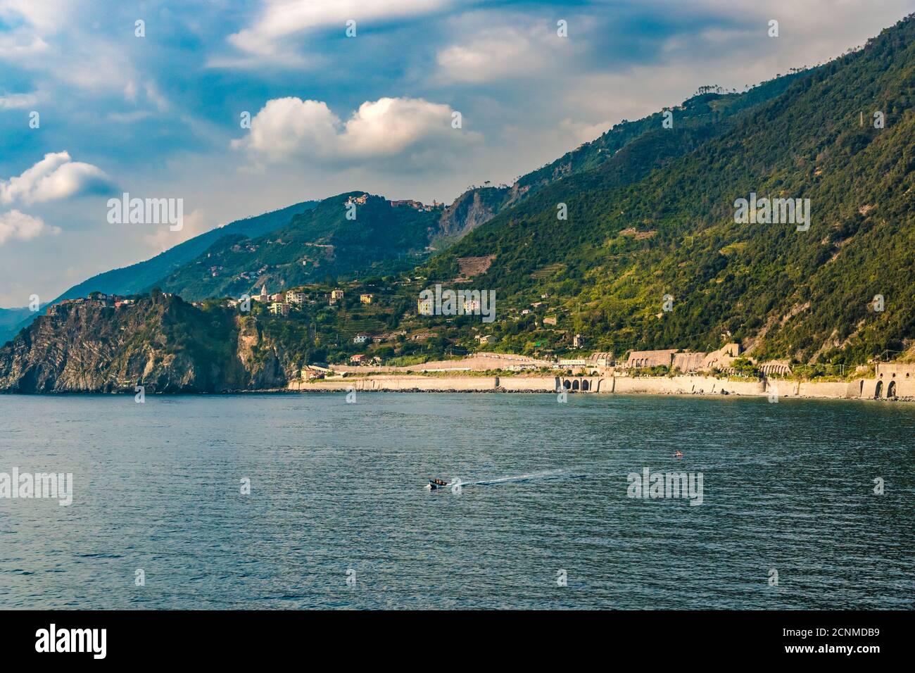 Panoramic view of the coastal area of Corniglia seen from Manarola. On the left side on top of the promontory is Corniglia and on the right side below... Stock Photo