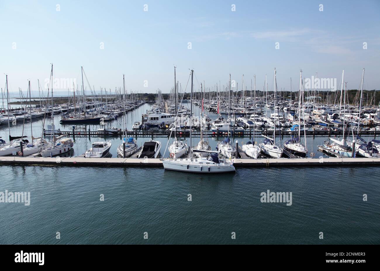 Lymington yacht haven marina on the Solent with yachts motorboats, pontoons and moorings. Stock Photo