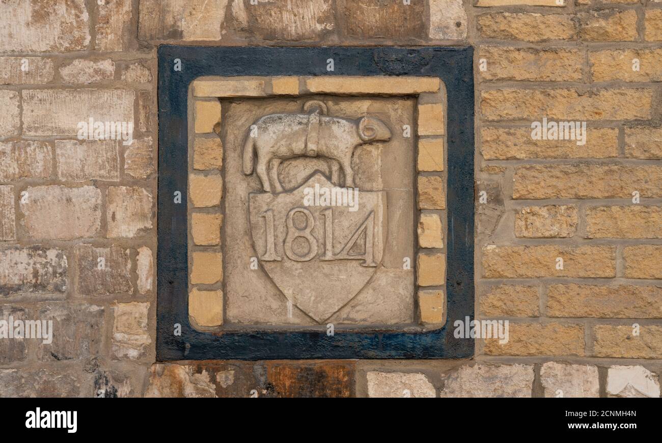 Nailsworth Mill - Old stone sign the only surviving symbol of Heskins and Barnard, clothiers and dyers, Nailsworth, England, United Kingdom Stock Photo