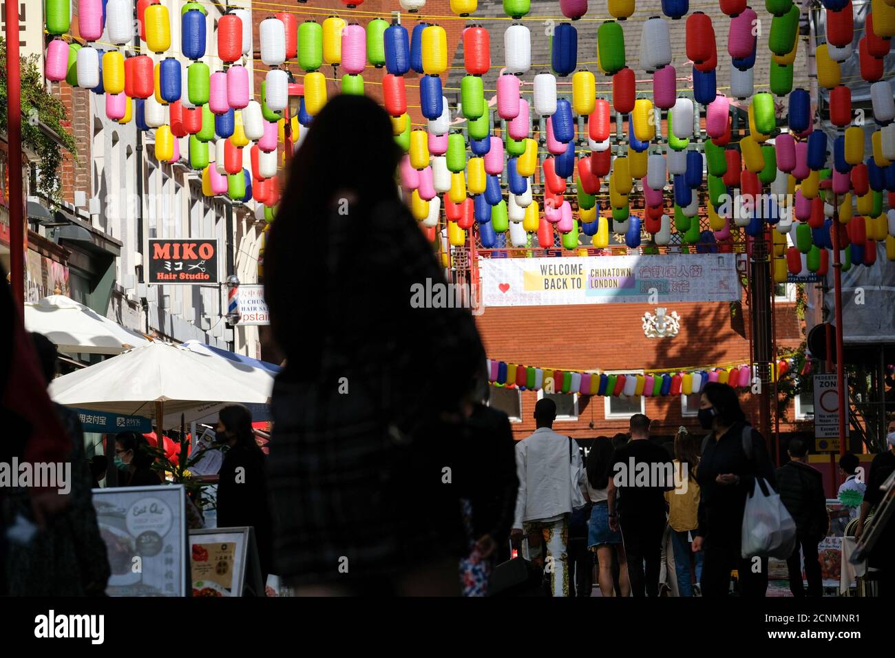 Chinatown, London, UK. 18th September 2020. The Love Chinatown campaign has multi-coloured lanterns replacing the traditional red lanterns as part of the campaign to revitalise the area. Credit: Matthew Chattle/Alamy Live News Stock Photo