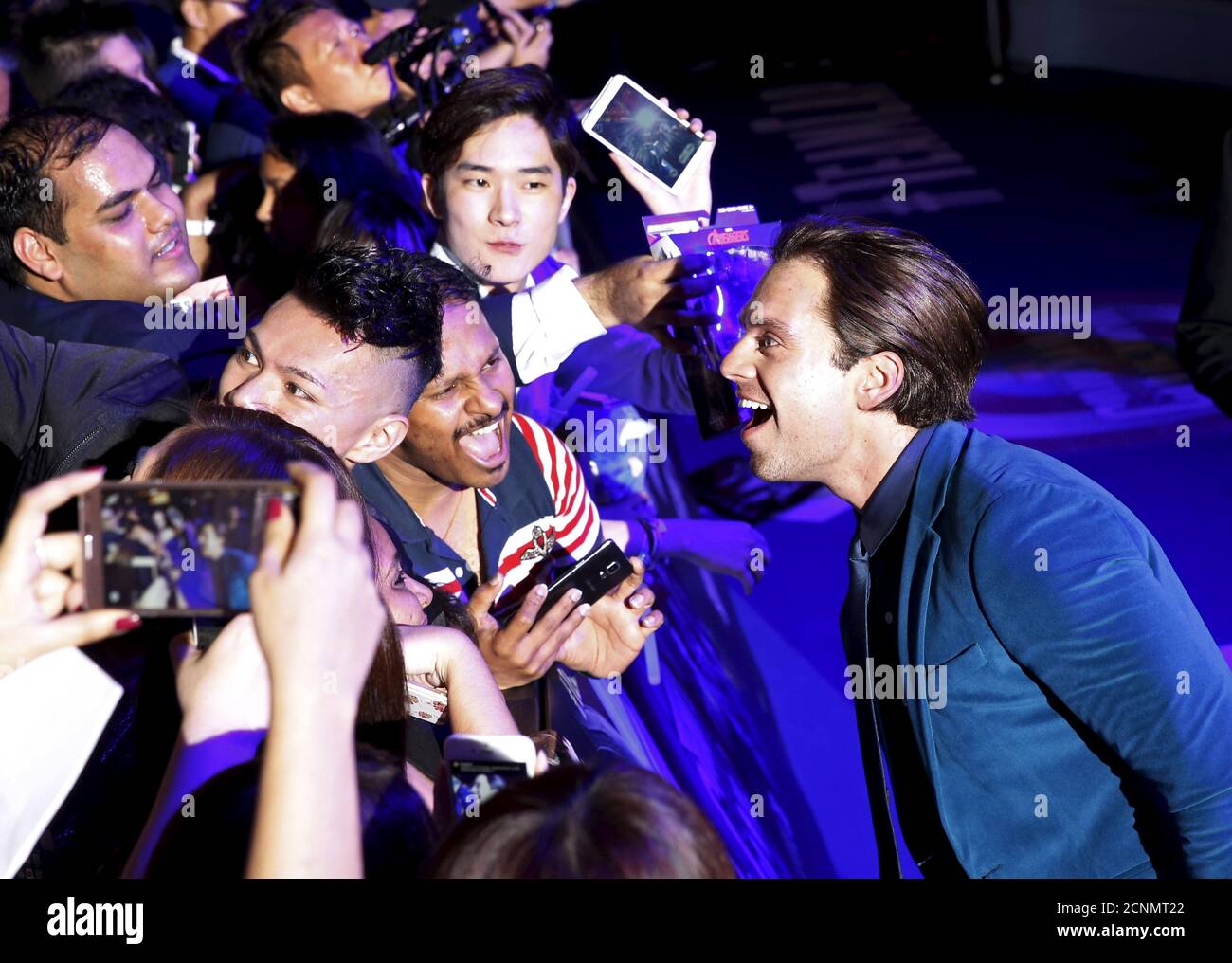 Actor Sebastian Stan mingles with fans during a blue carpet event for the movie 'Captain America Civil War' in Singapore, April 21, 2016. REUTERS/Edgar Su Stock Photo
