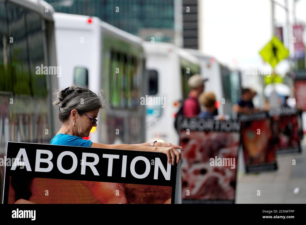 Anti-abortion protestors holding what they said were photos of abortions stand outside the building where new organizations are working at the Republican Presidential Convention in Cleveland July 14, 2016.  REUTERS/Rick Wilking Stock Photo