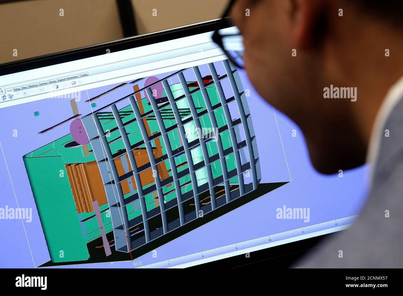 Product Development Engineer Jigar Patel works with a CAD image of a thrust reverser cascade in development at Oxford Performance Materials Inc., the maker of more than 600 parts to be used on Boeing's new Starliner manned spacecraft, in South Windsor, Connecticut, the maker of more than 600 parts to be used on Boeing's new Starliner manned spacecraft, in South Windsor, Connecticut, U.S., January 31, 2017. Picture taken January 31,2017. REUTERS/Mike Segar TPX IMAGES OF THE DAY Stock Photo