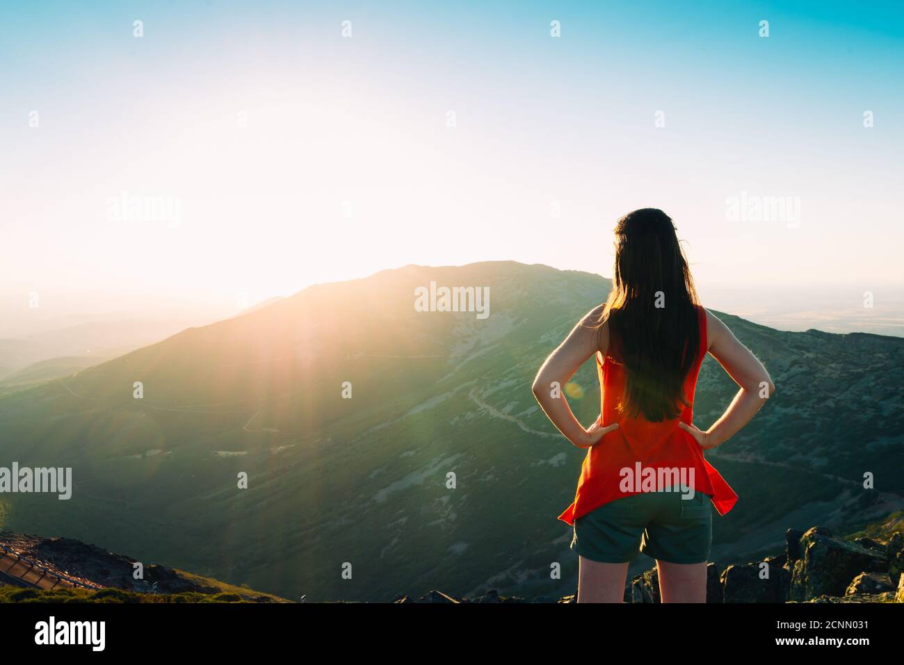 Woman standing watching golden hi-res stock photography and images - Alamy