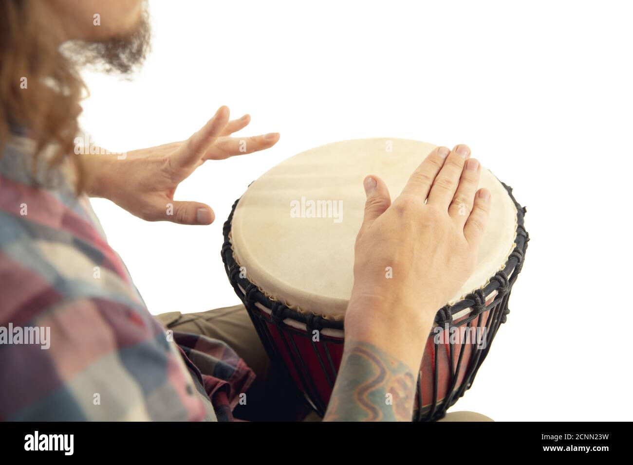 Man plays ethnic drum darbuka percussion, close up musician isolated on  white studio background. Male hands tapping djembe, bongo in rhythm.  Musical handmade instruments, world culture sound Stock Photo - Alamy