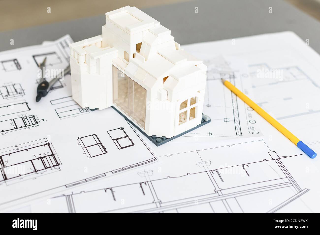 Construction plans with helmet and drawing Stock Photo - Alamy
