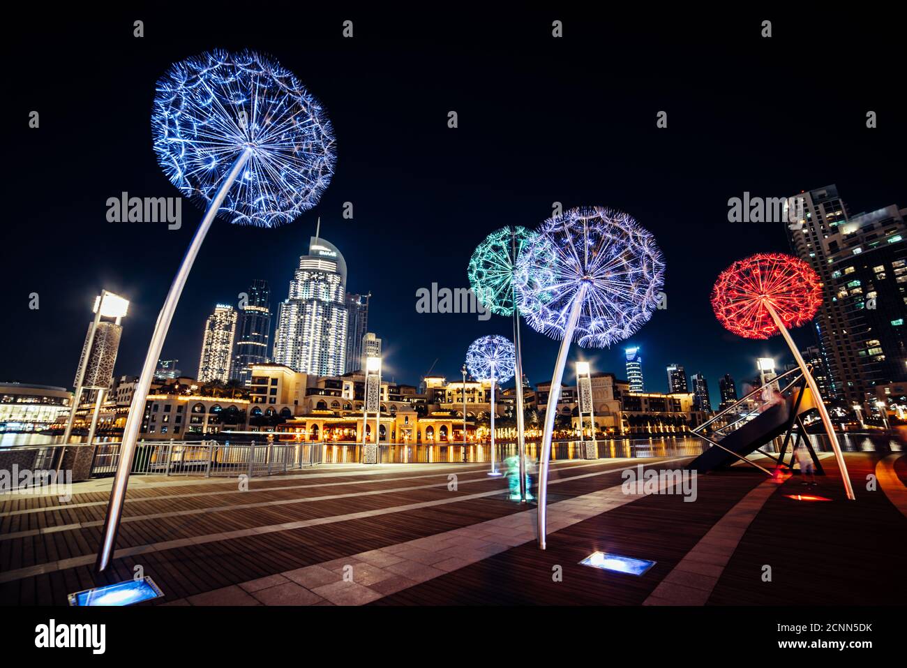Night urban street of Dubai, UAE with flower colorful lanterns Stock