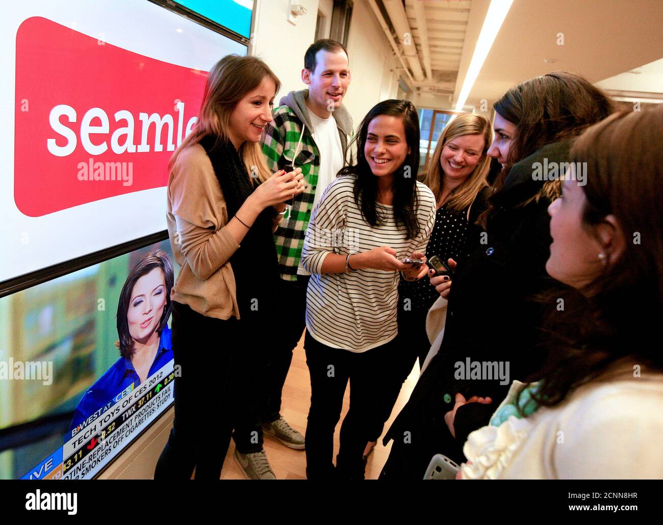 Staff from Seamless gather at their offices in New York January 10, 2012. Seamless, the online delivery service, is partnered with restaurants in over 30 major cities across the U.S. and Britain.  REUTERS/Brendan McDermid (UNITED STATES - Tags: BUSINESS FOOD) Stock Photo