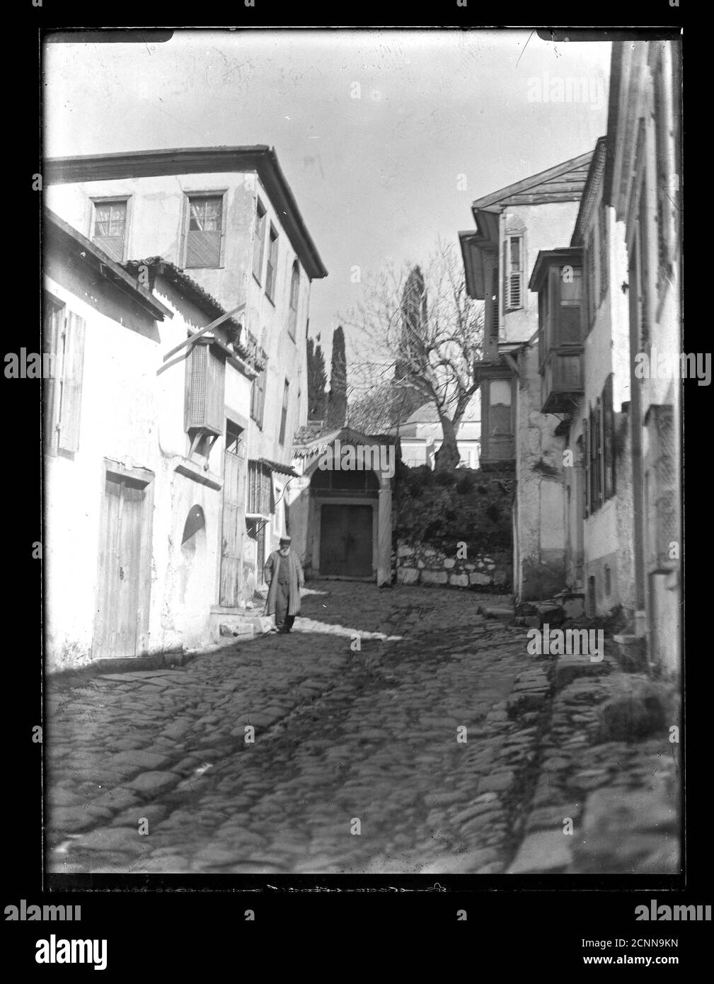 Turkey Izmir Manisa small town cobblestone alley, around 1910 in wintertime. Photograph on dry glass plate from the Herry W. Schaefer collection. Stock Photo
