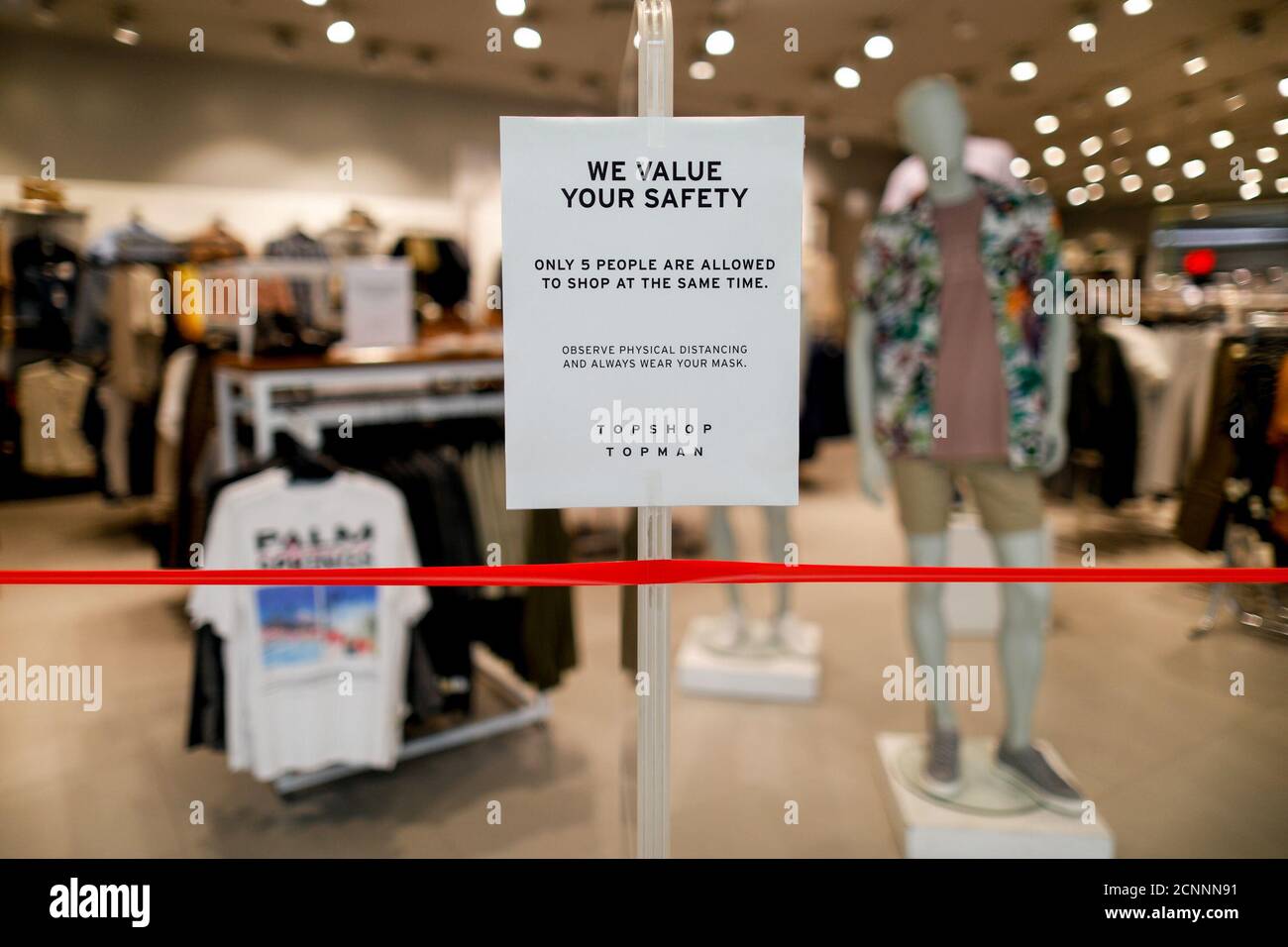 A reminder of safety precautions is posted outside a branch of UK clothing  brand TOPSHOP inside the SM Mall of Asia, amid the coronavirus disease  (COVID-19) outbreak, in Pasay City, Metro Manila,