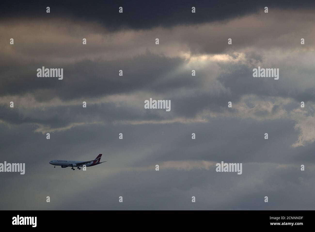 A Qantas plane approaches Kingsford Smith International Airport amidst the easing of the coronavirus disease (COVID-19) restrictions in Sydney, Australia, May 28, 2020.  REUTERS/Loren Elliott Stock Photo