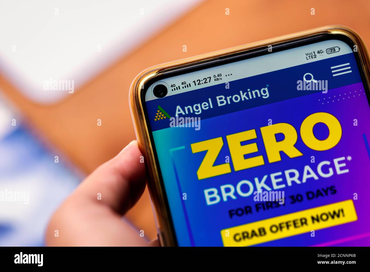 West Bengal, India, September 17, 2020 : Angel Broking IPO. Hand holding mobile and using Angel Broking official website. A broker that offers to inve Stock Photo