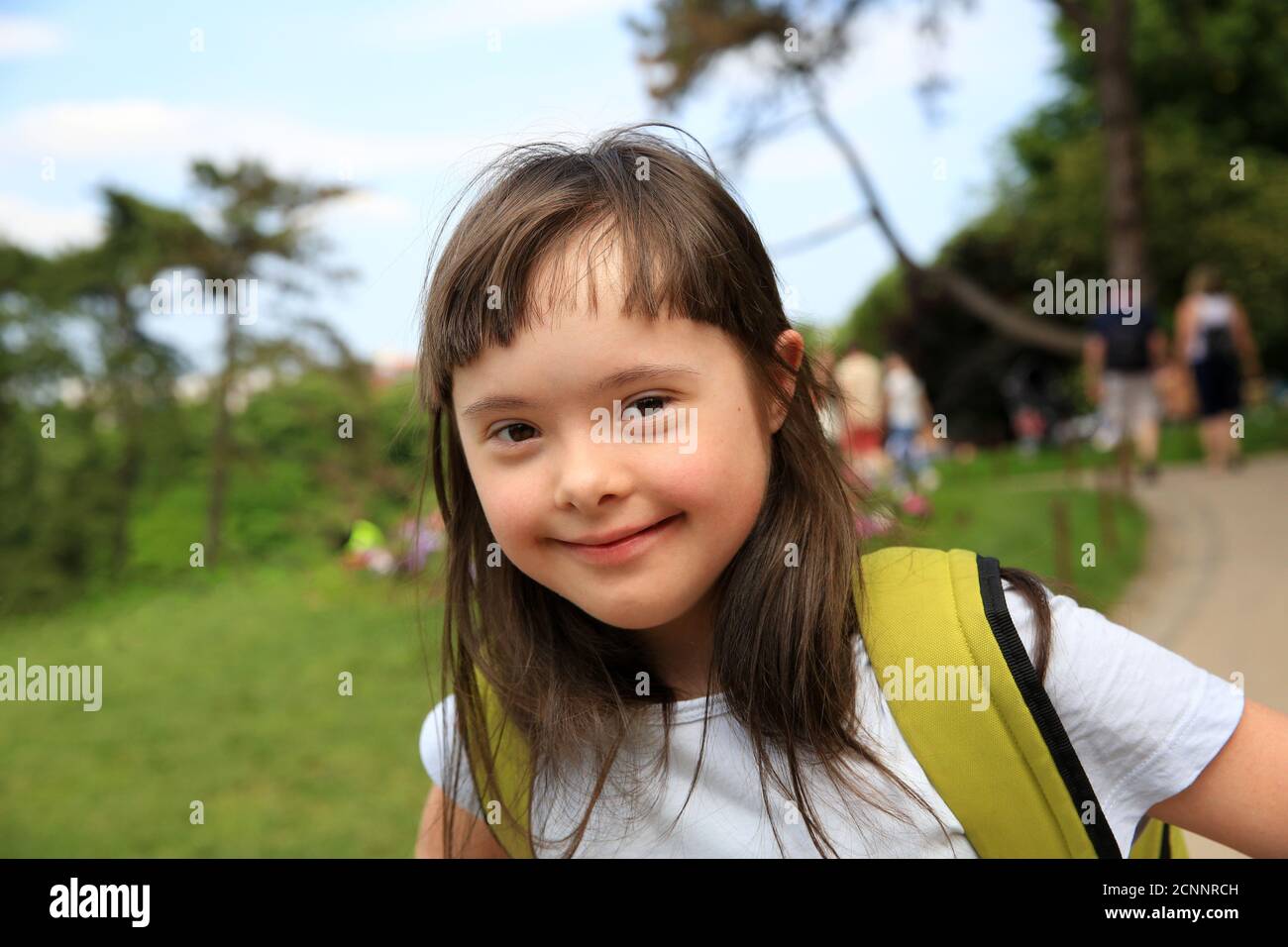 Portrait of little girl smiling in the park Stock Photo - Alamy