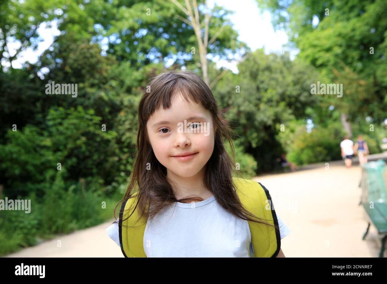 Portrait of little girl smiling in the park Stock Photo - Alamy