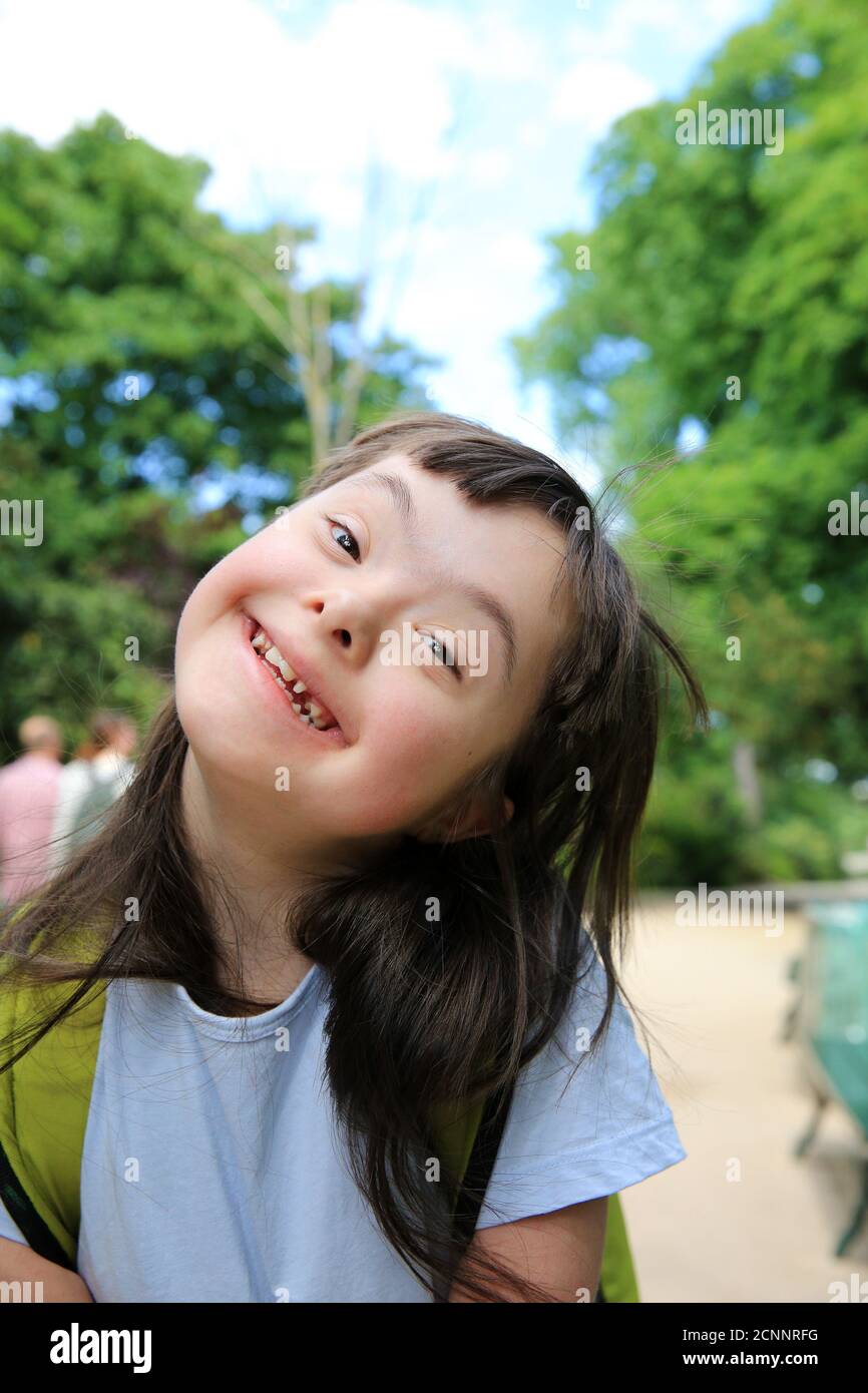 Portrait of little girl smiling in the park Stock Photo - Alamy