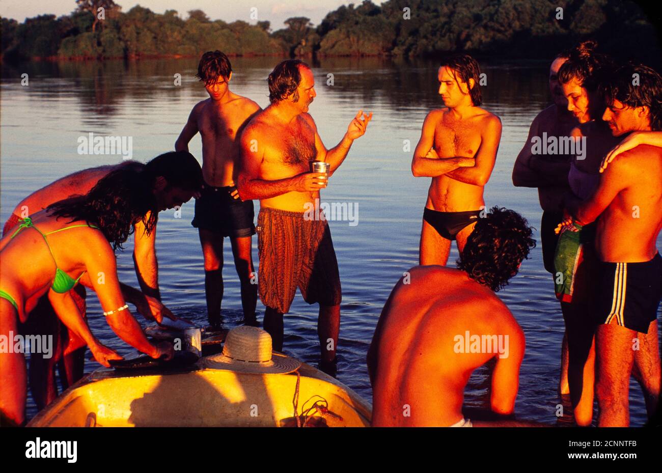 Pantanal, Brazilian telenovela – TV serial drama , soap opera -  originally aired in 1990 on Rede Manchete – Brazilian television network extintic in 1999 - written by Benedito Ruy Barbosa and directed by Jayme Monjardim - actors Claudio Marzo, Almir Sater, Marcos Winter, Cristiana Oliveira, Angelo Antonio and others relax at the riverside during a break on the recordings. The Pantanal region, whose name derives from the Portuguese word pântano - meaning swamp -  is one of the largest freshwater wetland ecosystems in the world. The region has been called an ecological paradise. The location, a Stock Photo
