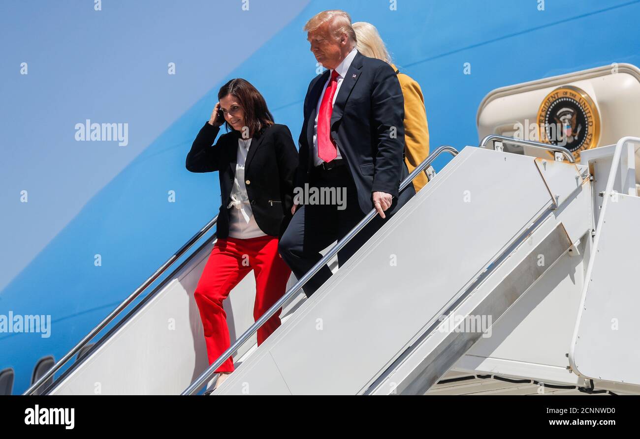 U.S. President Donald Trump walks down the steps of Air Force One with U.S. Senator Martha McSally (R-AZ) as he arrives to visit a nearby U.S. Border Patrol station and a U.S.-Mexico border wall site after landing at Marine Corps Air Station Yuma in Yuma, Arizona, U.S., June 23, 2020. REUTERS/Carlos Barria Stock Photo