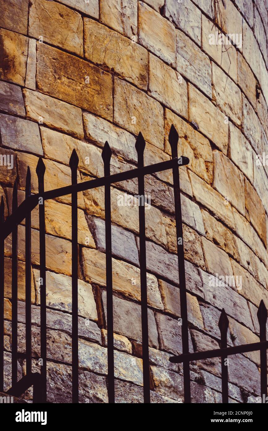 Old vintage railings in an ancient city wall at York UK Stock Photo - Alamy