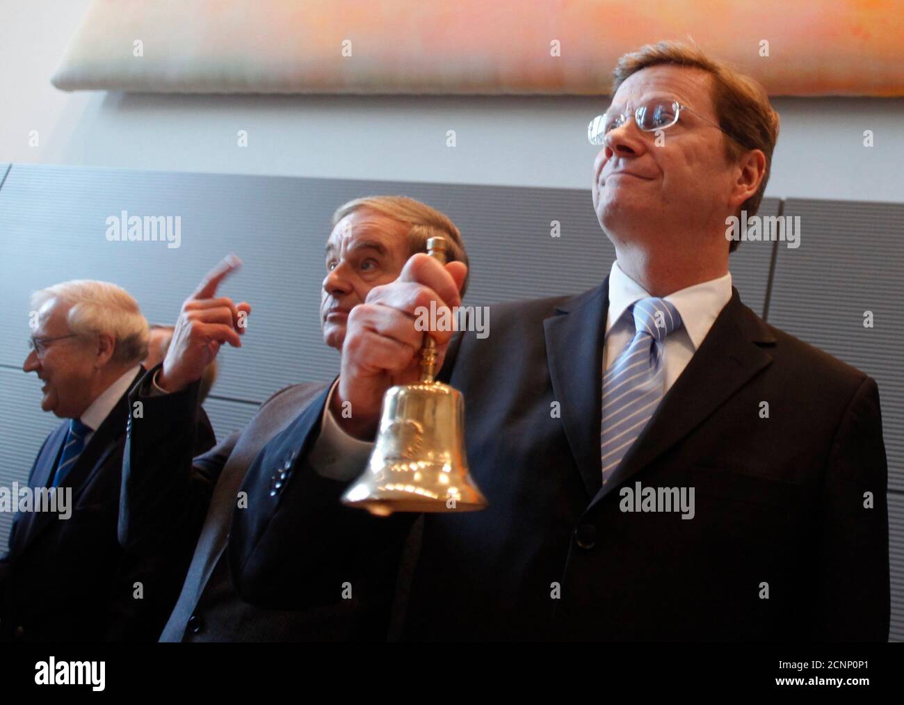 Leader of the Free Democrats Party (FDP) Guido Westerwelle (L) opens a meeting of the FDP parliamentary group in Berlin October 20, 2009. Also pictured are leading party members Rainer Bruederle and Joerg van Essenl  REUTERS/Thomas Peter (GERMANY POLITICS) Stock Photo