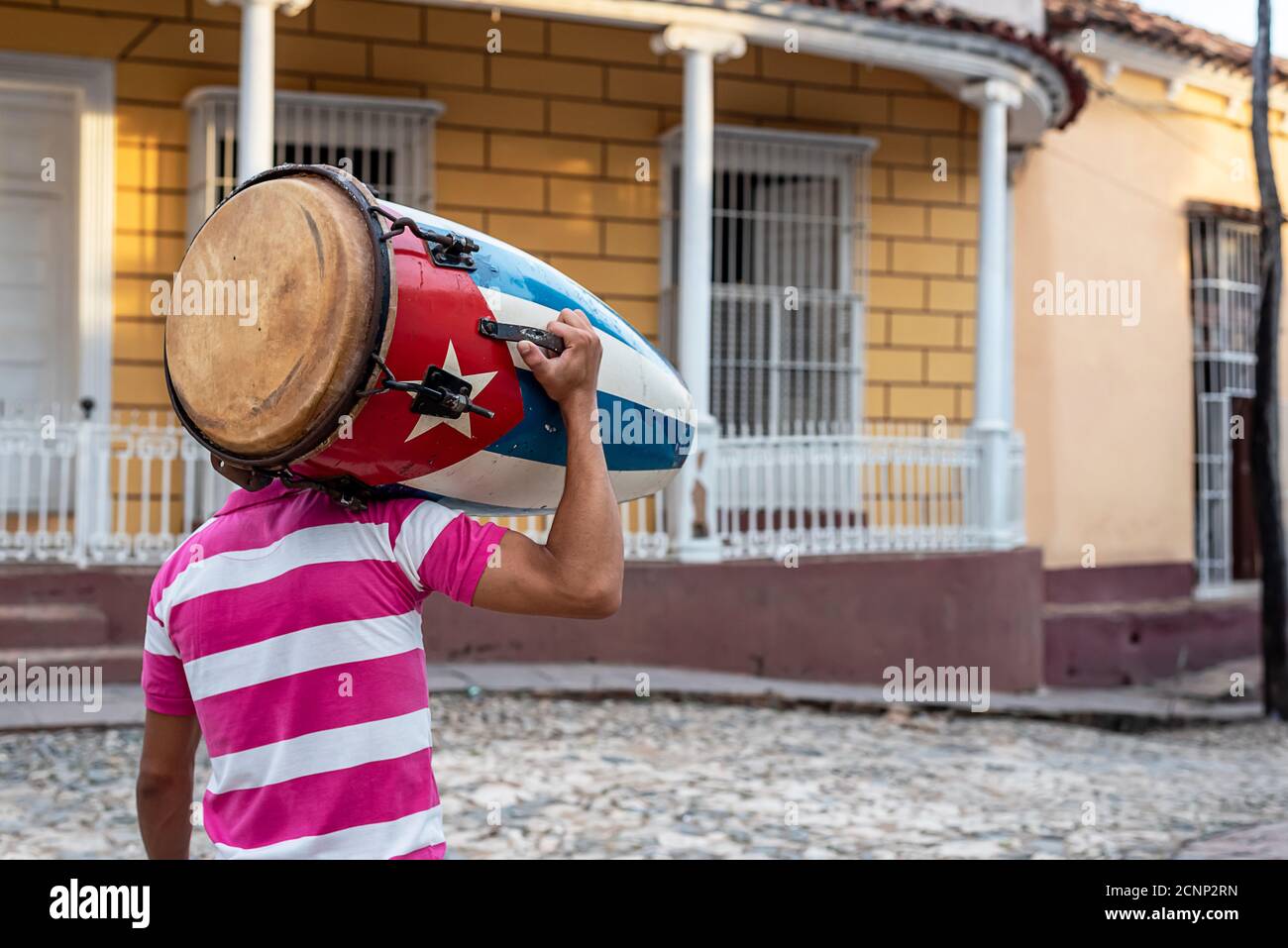 August 25, 2019 Musician carrying a conga with the flag of Cuba