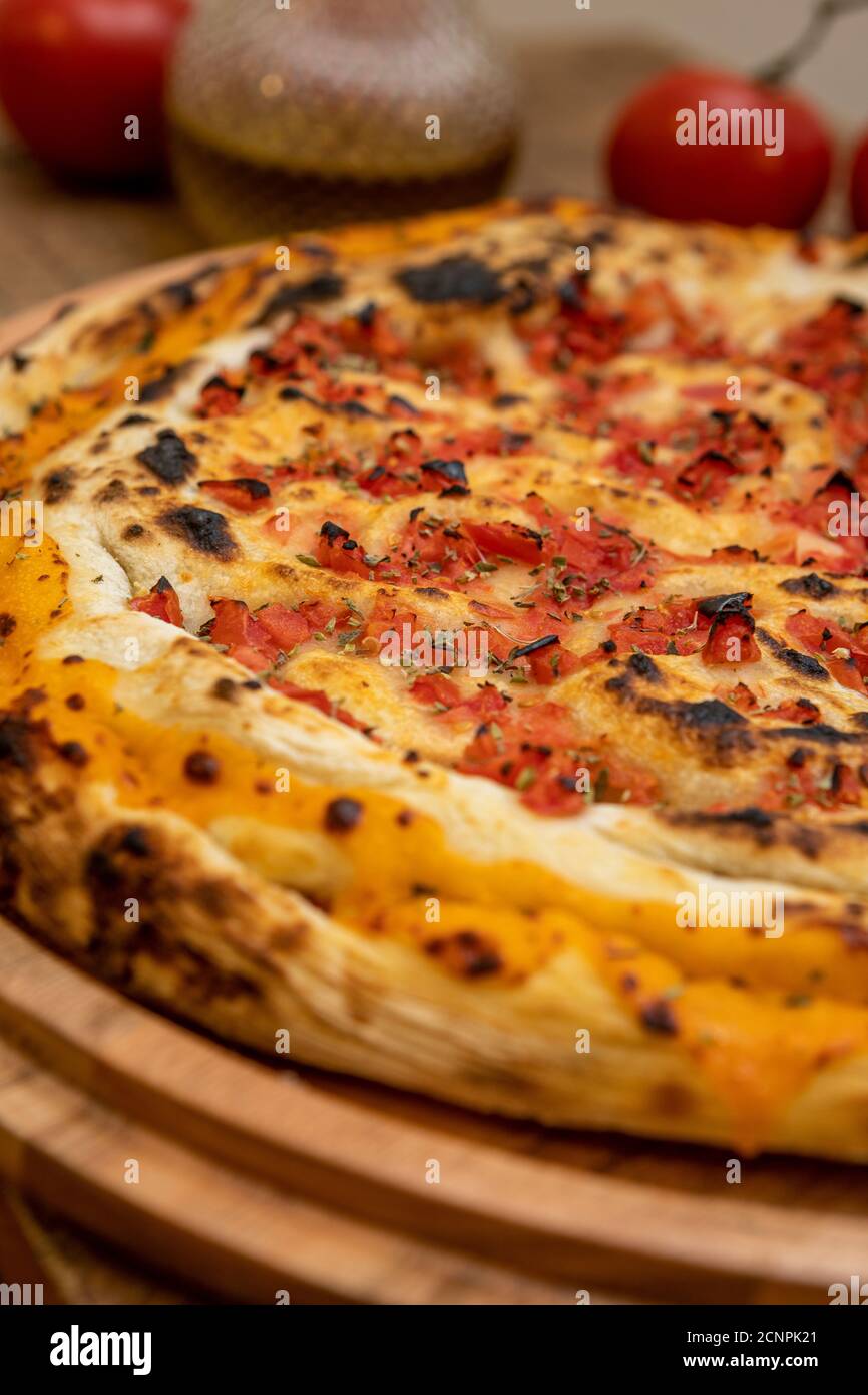 Calzone - Stuffed Pizza with Tomato, Mozzarella and Ham Stock Photo