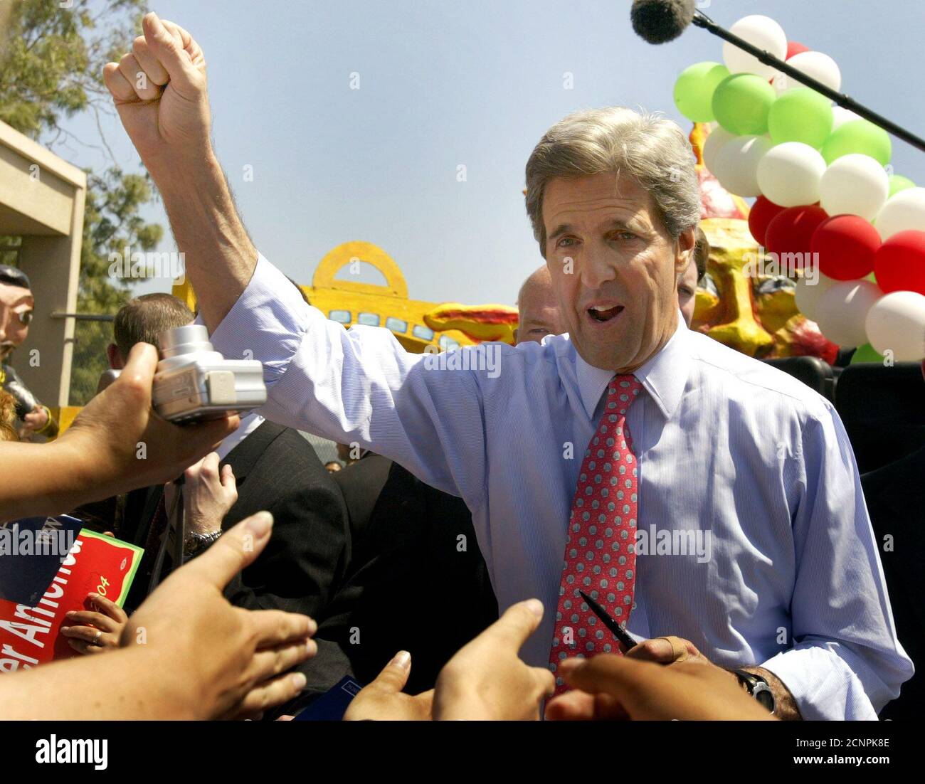 U.S. Democratic Presidential candidate John Kerry greets a crowd at Woodrow Wilson High School in Los Angeles, May 5, 2004. Kerry, the presumptive Democratic presidential nominee, has vowed to take a tougher line than U.S. President George W. Bush against foreign exchange manipulation. Last week, he pledged 'a no-nonsense effort to stop illegal currency manipulation that's going in countries like China and Japan.' REUTERS/Lucy Nicholson US ELECTION  LN/GN Stock Photo