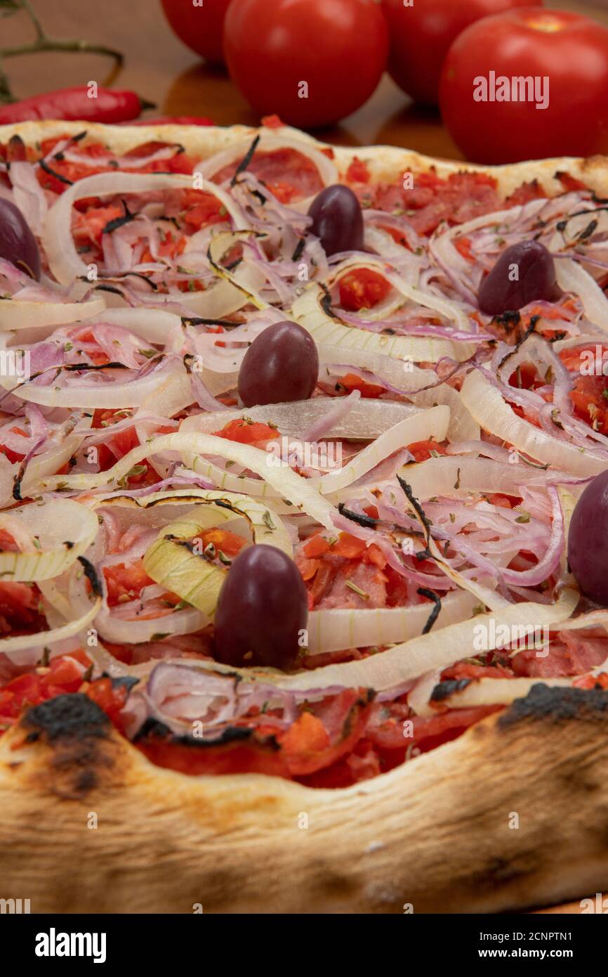 Pizza de Calabresa, Brazilian food. Calabrese sausage pizza with