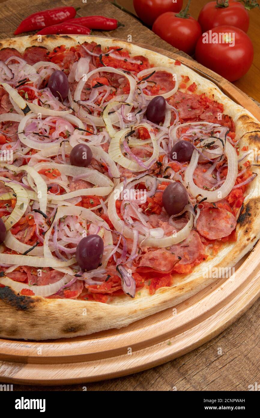 Pizza de Calabresa, Brazilian food. Calabrese sausage pizza with