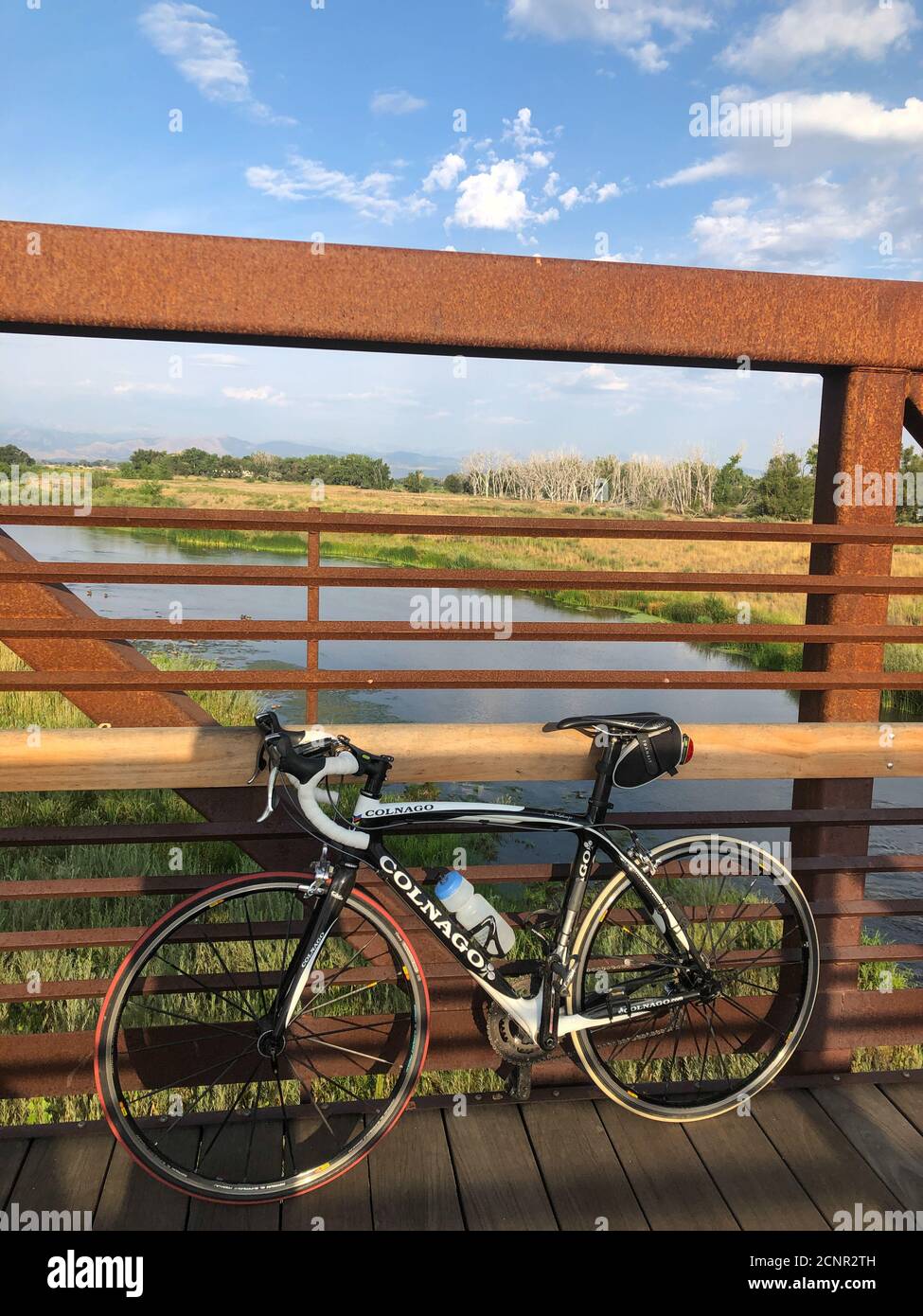 Riding my favoriteConalgo road bike to Sandstone Ranch park near Longmont, Colorado. Overlooking river and grassland at early morning. Stock Photo