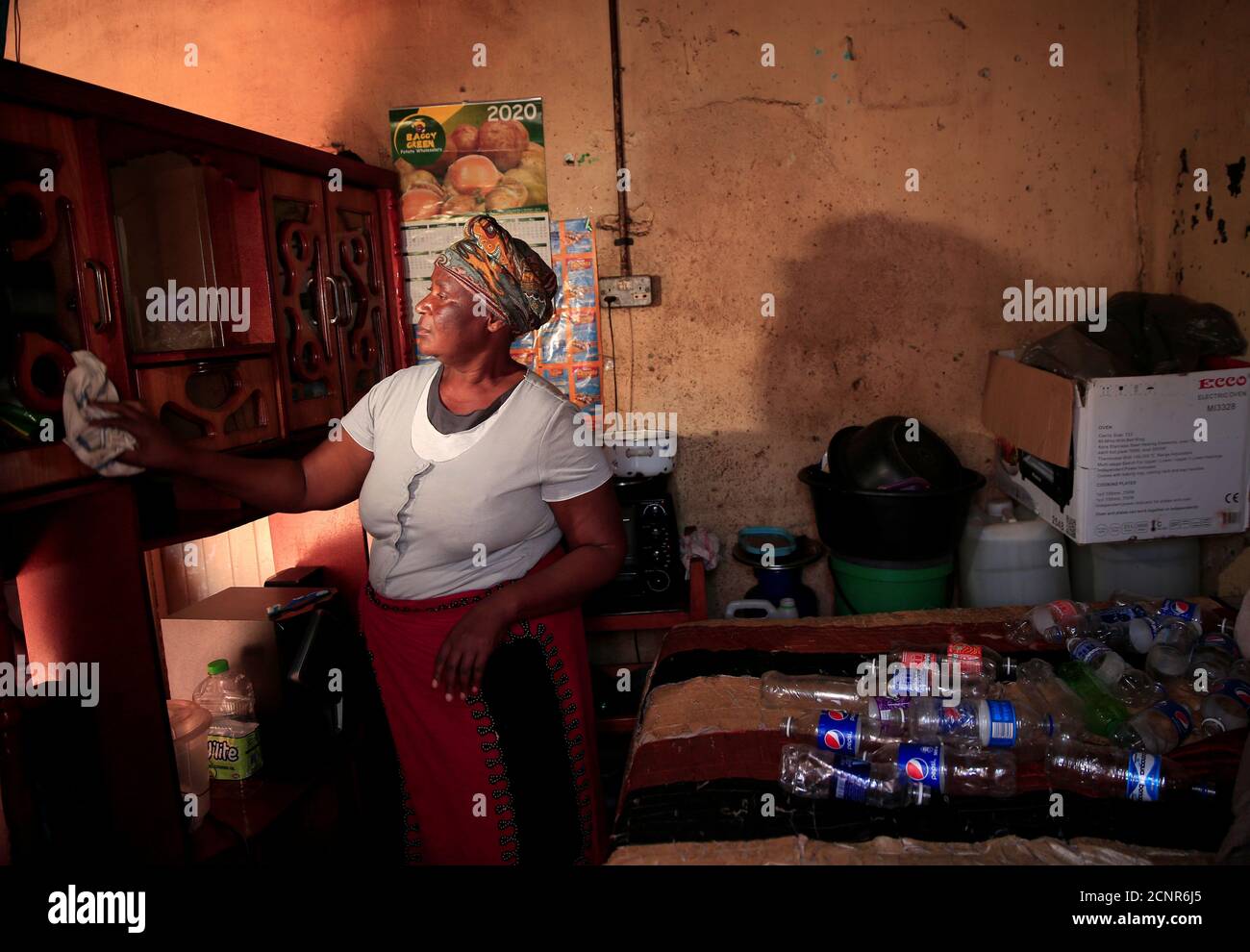 Rosemary Pamire cleans her home during a nationwide lockdown to help curb the coronavirus disease (COVID-19) spread in Harare, Zimbabwe, May 9, 2020. Picture taken May 9, 2020. REUTERS/Philimon Bulawayo Stock Photo
