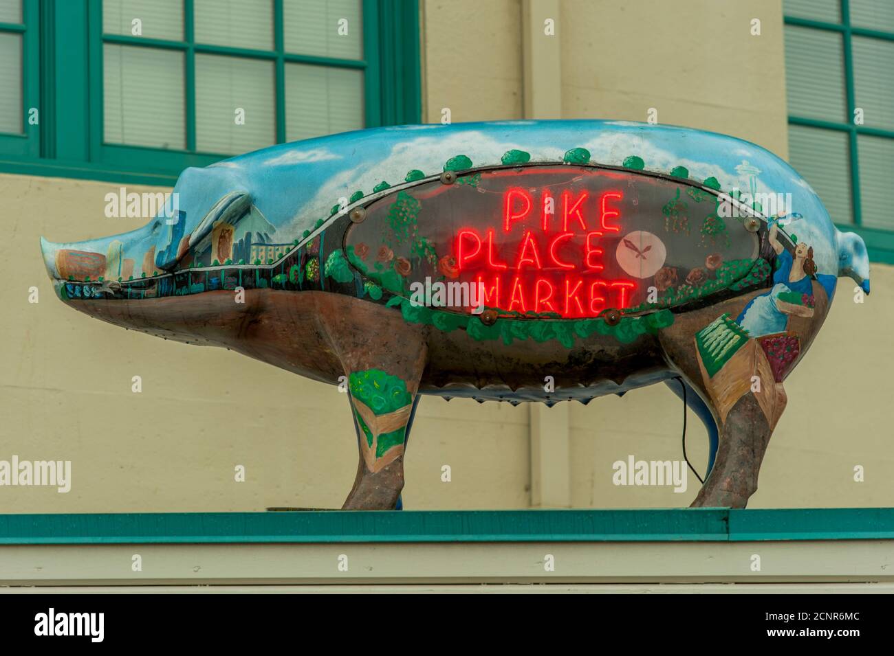 A pig statue with a neon Pike Place Market sign at the Pike Place ...