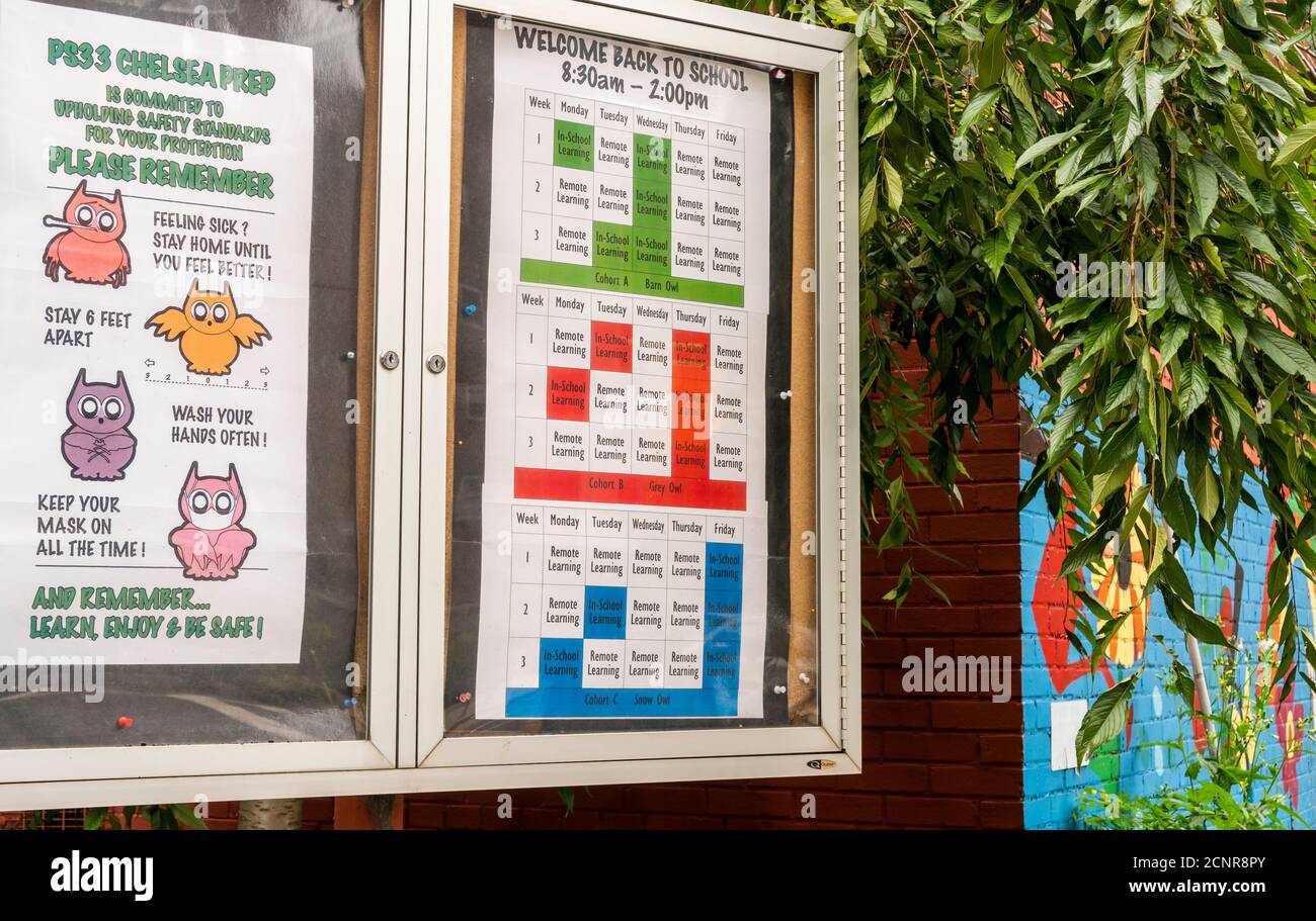 A poster informs students and their parents of the schedule regarding in-person and distance learning at PS33 in the Chelsea in New York on Sunday, September 13, 2020. In-person learning is scheduled to start on September 21. (© Richard B. Levine) Stock Photo
