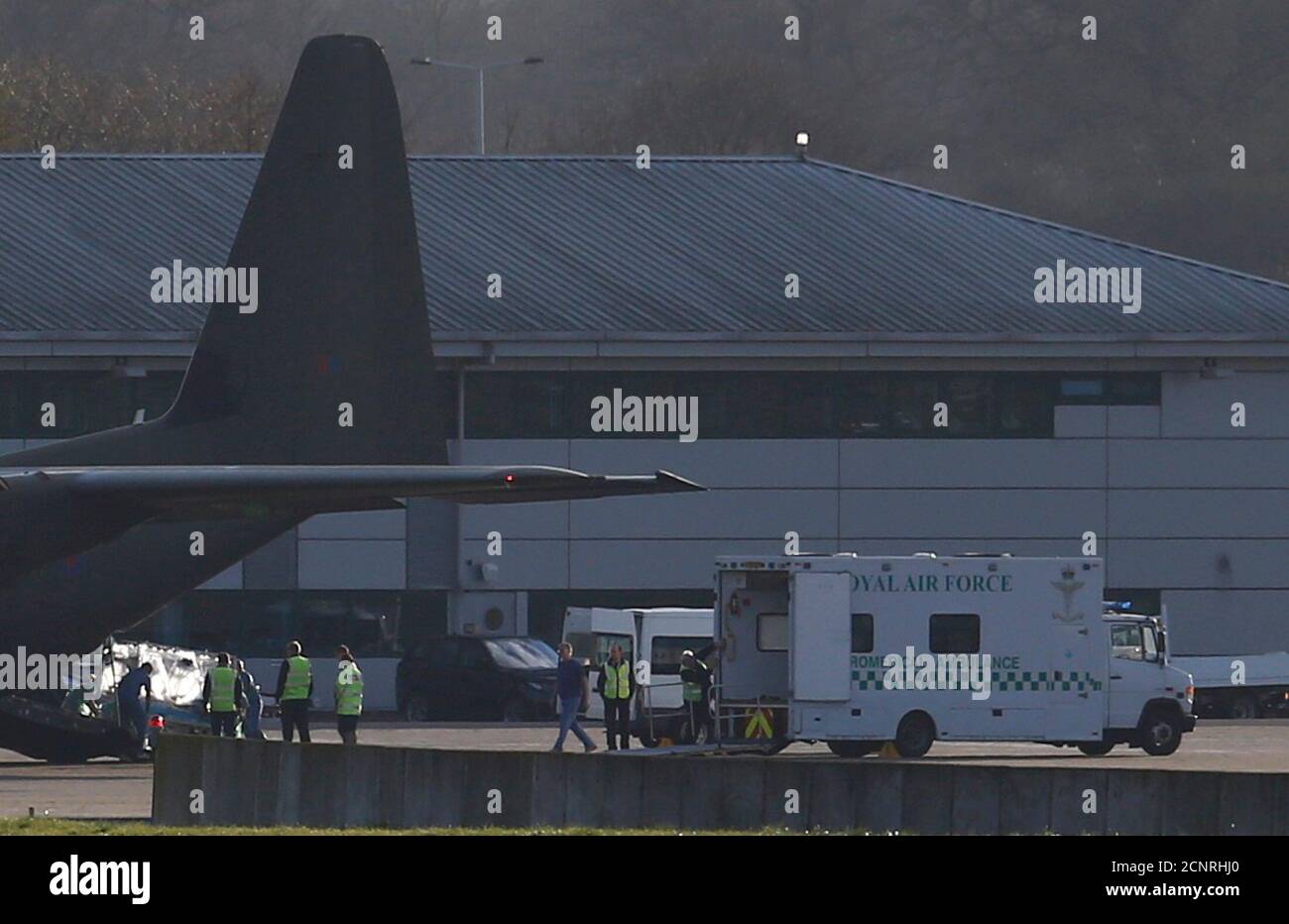 Nurse Pauline Cafferkey is moved on an isolation bed from a Royal Air Force  C130 to a waiting ambulance after landing at Northolt just west of London,  February 23, 2016. A Scottish